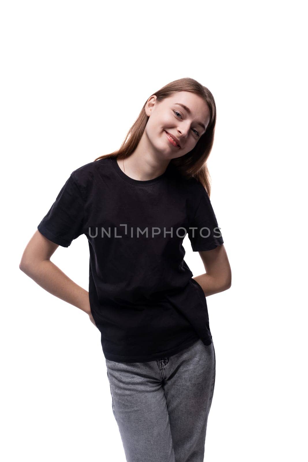 A 15 year old girl with brown hair is wearing a black basic T-shirt by TRMK