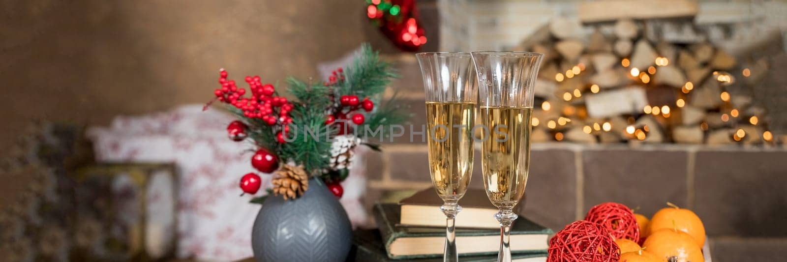 Picture of Christmas table setting, retro style photo, glasses for champagne, golden Christmastime decorations