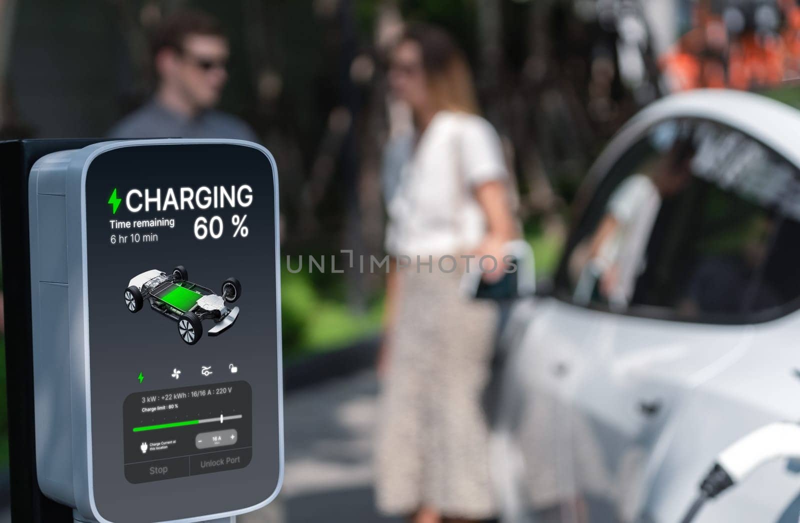 Young couple travel with EV electric car charging in green sustainable city outdoor garden in summer shows urban sustainability lifestyle by green clean rechargeable energy of electric vehicle innards