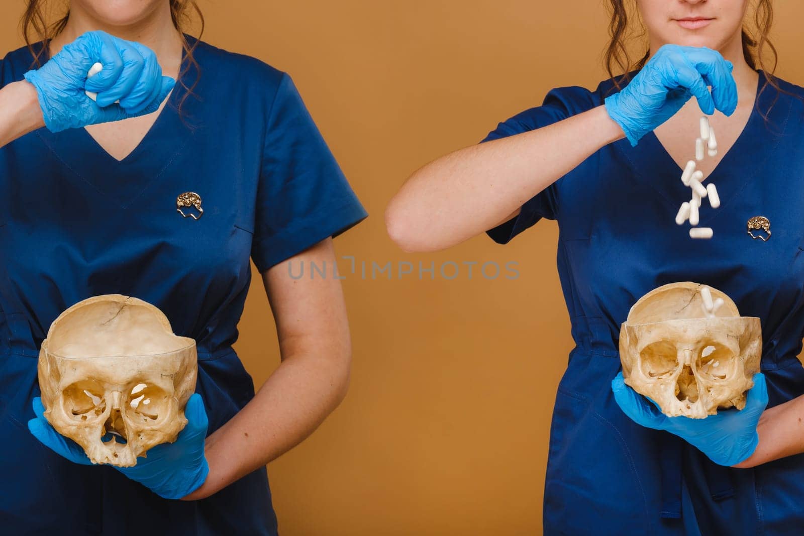 A pretty young doctor pours vitamin capsules into a human skull. The doctor pours pills on the background. by Lobachad
