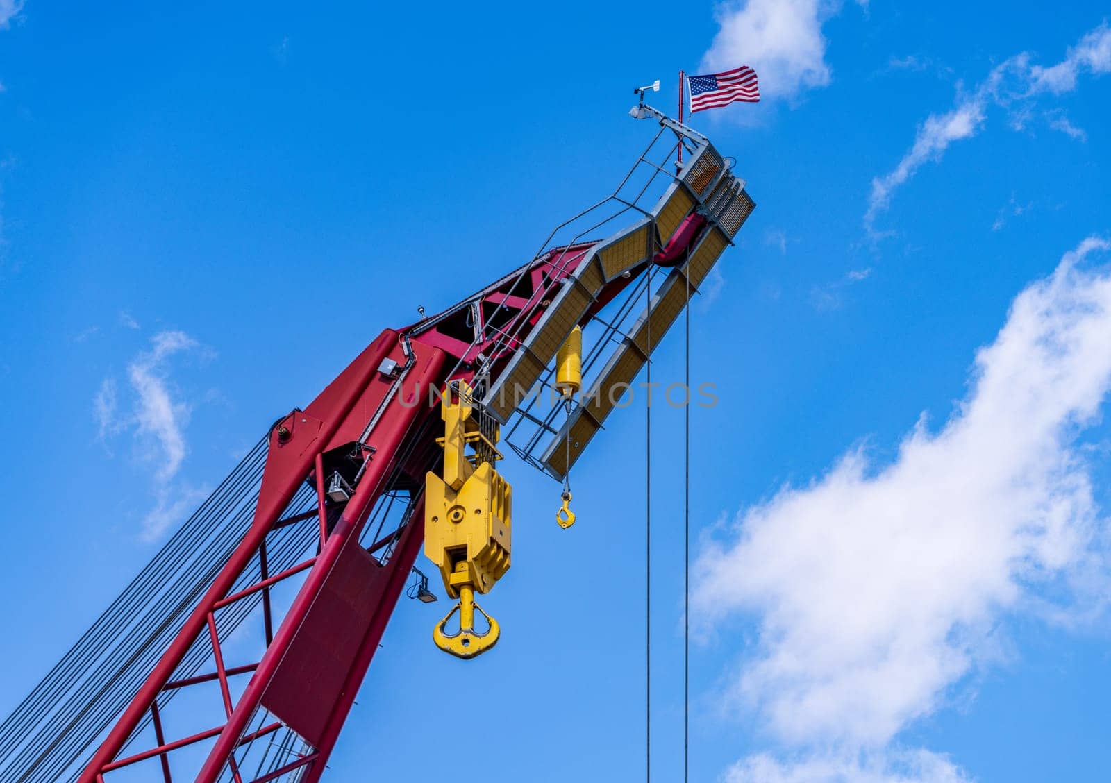 Detail of the many steel cables in powerful crane lifting heavy objects by steheap