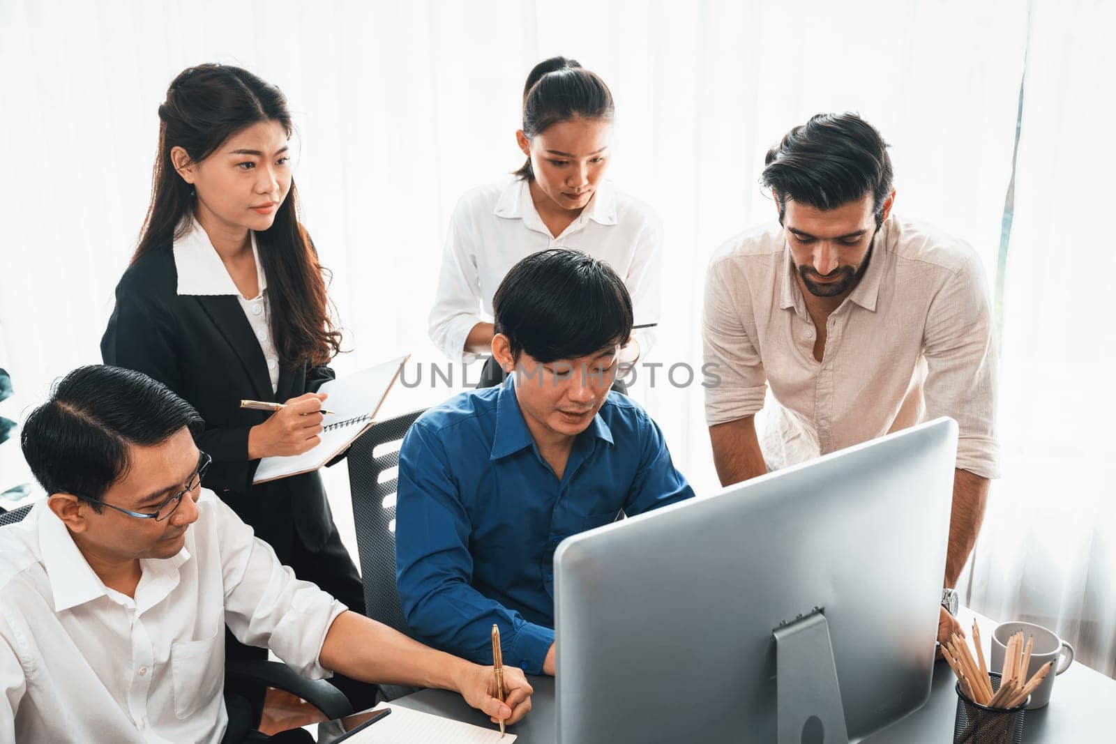 Group of diverse office worker employee working together on strategic business marketing planning in corporate office room. Positive teamwork in business workplace concept. Prudent