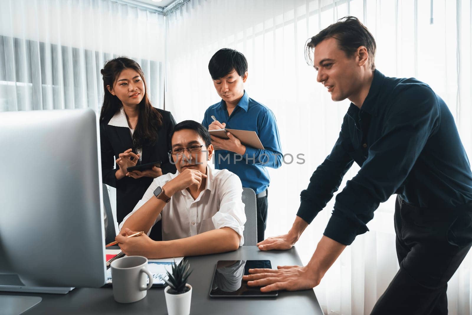 Group of diverse office worker employee working together on strategic business marketing planning in corporate office room. Positive teamwork in business workplace concept. Prudent