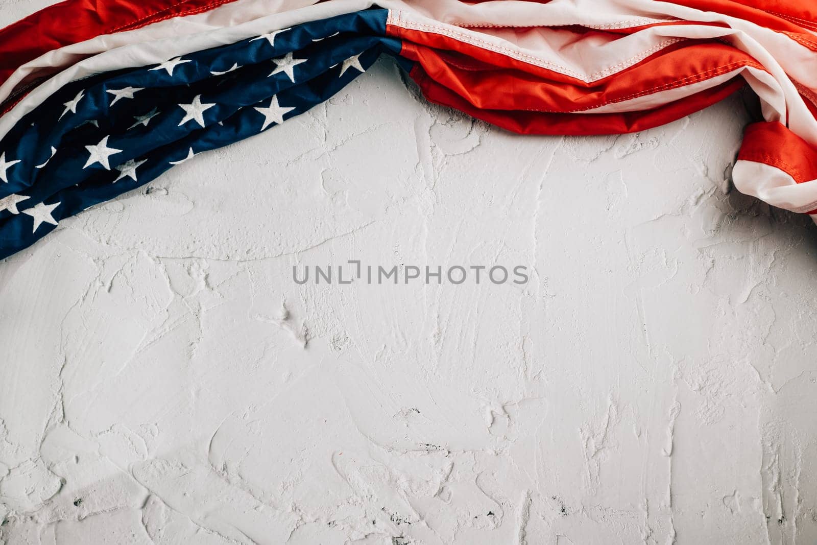 Vintage American flag for Veteran's Day, symbolizing honor, unity, and pride. Stars, stripes, and government in the USA are integral to patriotic glory. isolated on cement background
