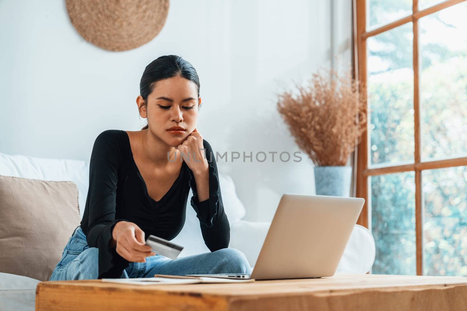 Stressed young woman has financial problems with credit card debt to pay uttermost show concept of bad personal money and mortgage pay management crisis.