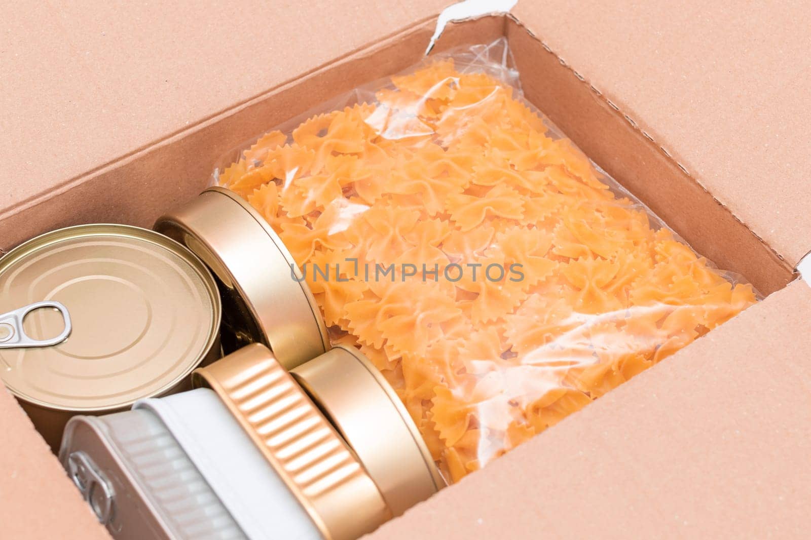 Food Reserves or Donation Box: Carton Box with Canned Food, Cereals and Grocery. Emergency Food Storage in Case of Crisis. Free Social Help, Blessings and Care. Strategic Food Supplies