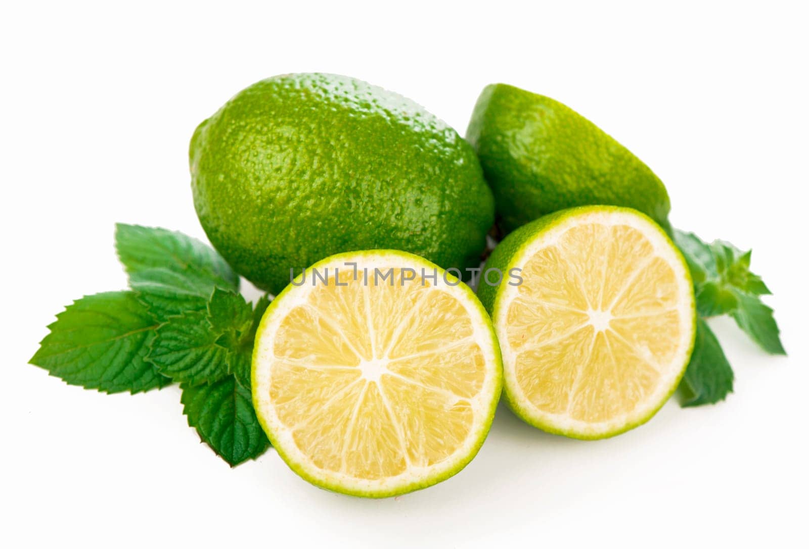 Half of lime citrus fruit. Lime cut isolated on white by aprilphoto