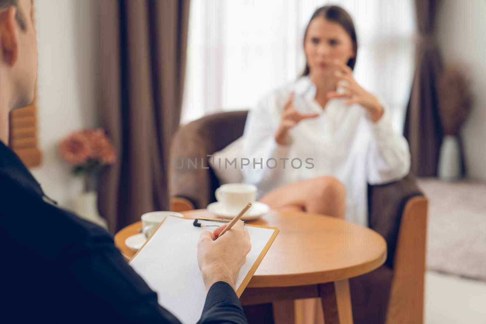 Psychological consultation gaining improvement on mental problem, happy young female patient doing therapy session while psychiatrist making diagnostic on mental illness. Unveiling