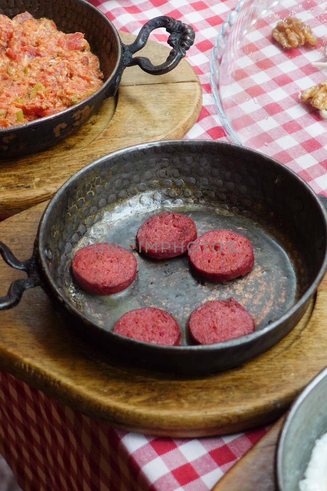 salami sausage in pan served with cheese on table by towfiq007