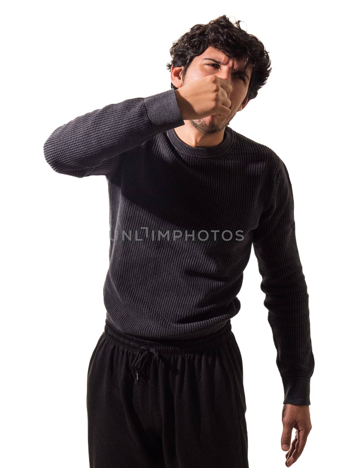 A man covering his mouth with his hands. A Man's Surprise and Shock Concealed Behind His Hands