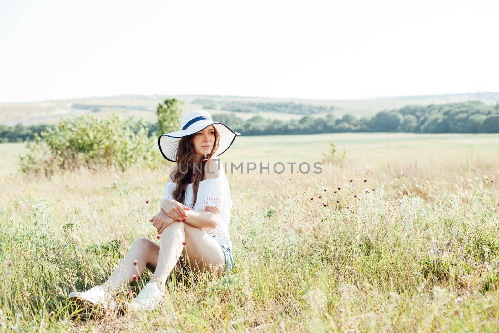 Portrait of a beautiful rural girl in a rural field by Simakov