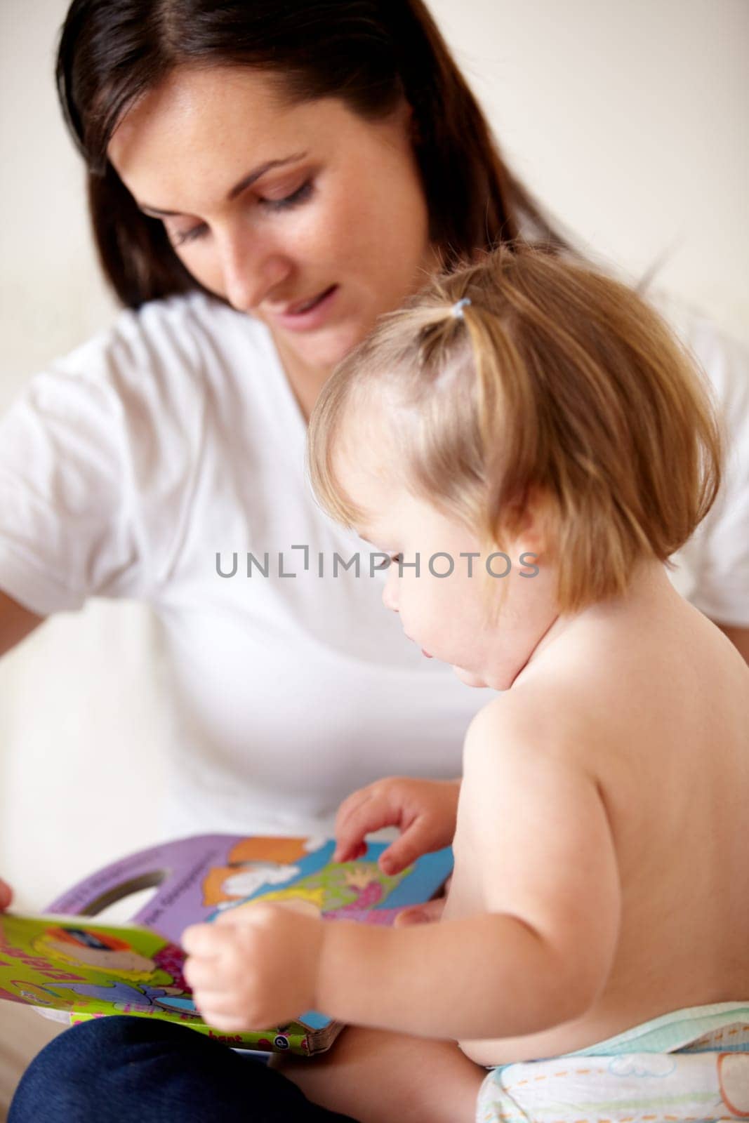 Baby, mother and book or reading on sofa with learning, relax and parenting in living room of home. Family, woman and girl child with support on couch in lounge for development, love or education.