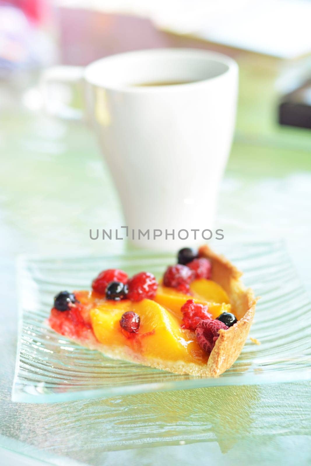 A piece of pie with peaches and berries by Godi