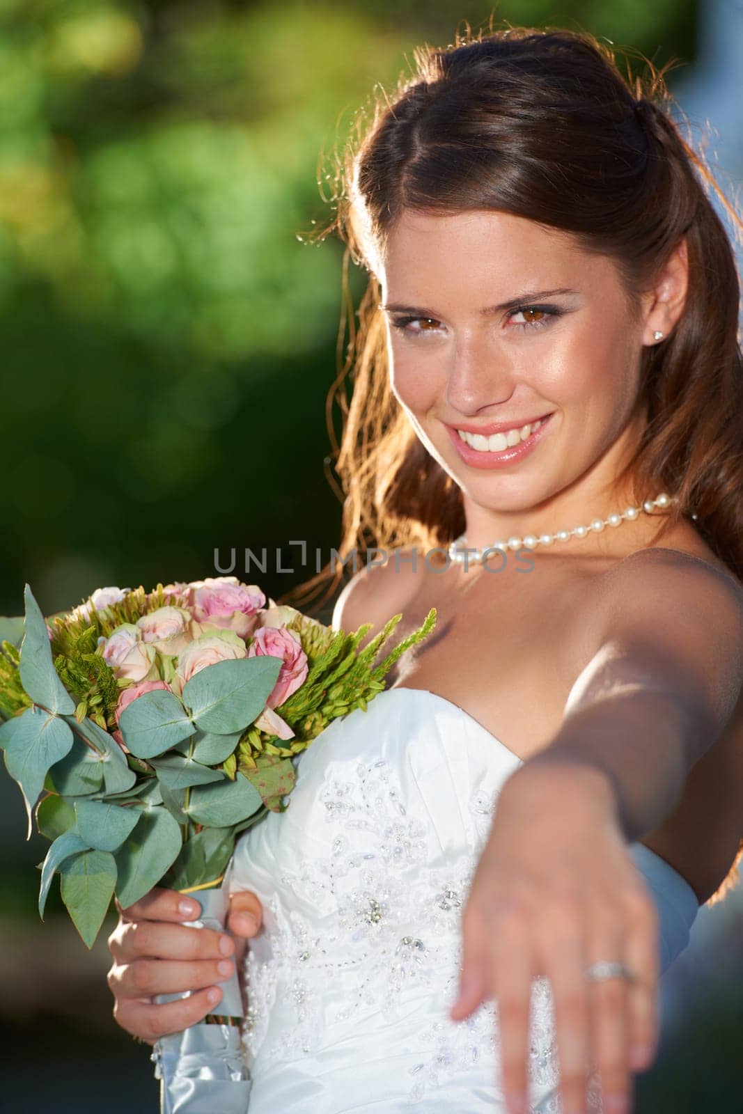 Bride, ring portrait and smile outdoor for love, wedding and celebration ceremony with confidence. Jewelry, woman and happy from future marriage, romance and formal event in a garden with a dress by YuriArcurs