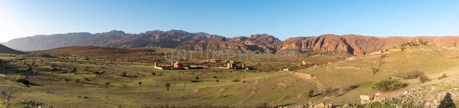 Panorama of dwellings in the Tizourgane region, mountains of the Anti-Atlas in the background, Morocco