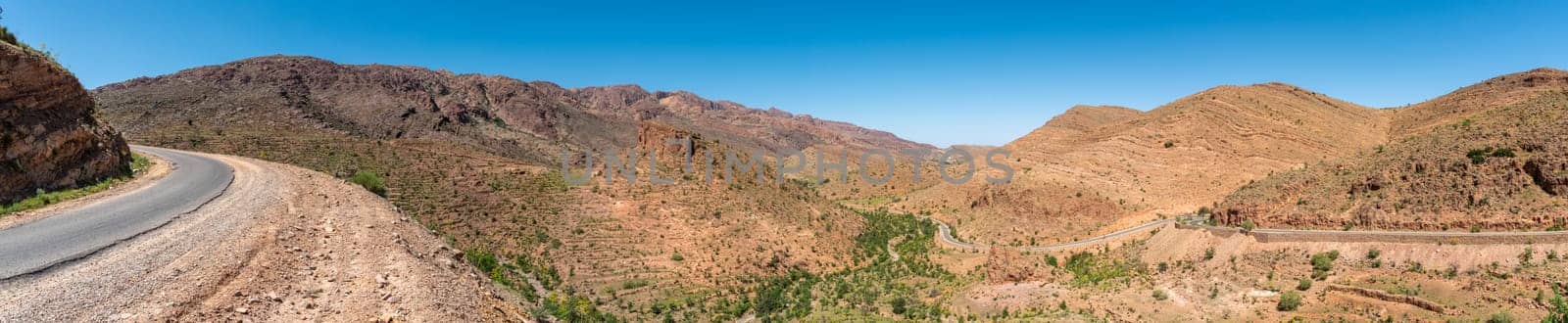 Great panoramic landscape of the Anti-Atlas mountains in the Taourirt region, a road winding through the mountains, Morocco