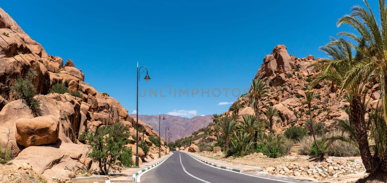 Driving through the scenic Tafraoute valley in the Anti-Atlas mountains by imagoDens