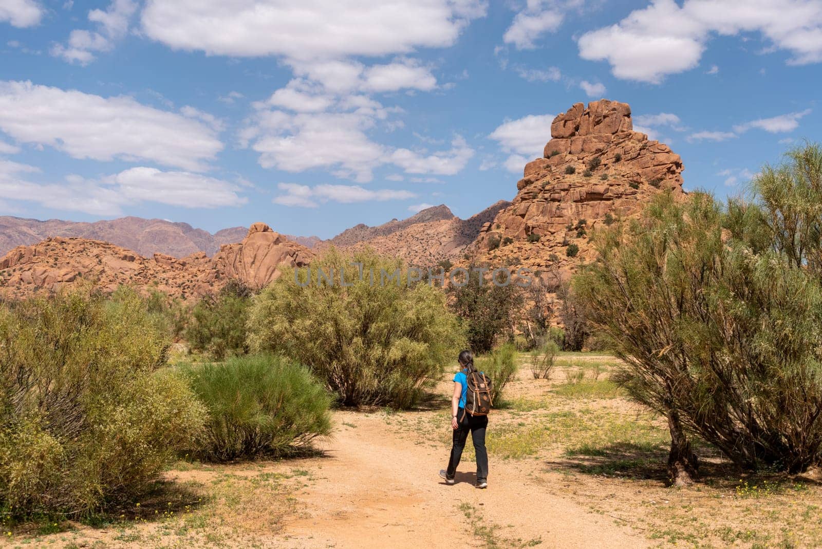 Hiking through the scenic Tafraoute valley in the Anti-Atlas mountains in Morocco