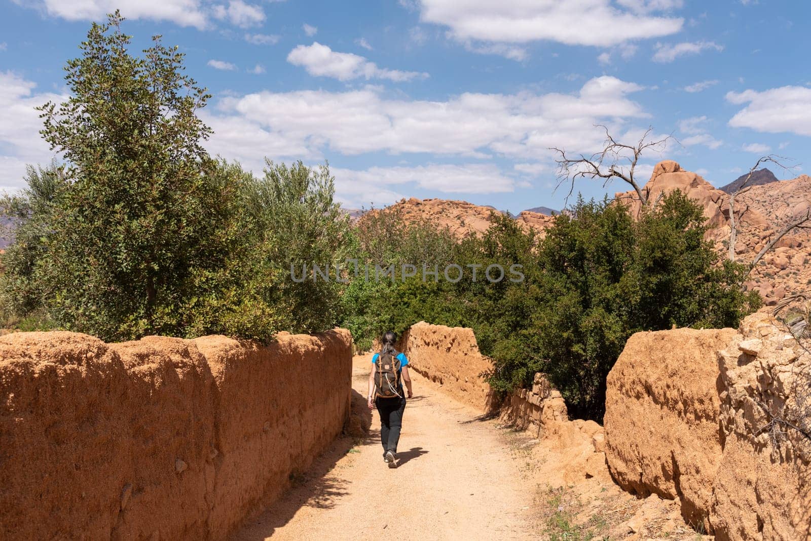 Hiking through the scenic Tafraoute valley in the Anti-Atlas mountains in Morocco