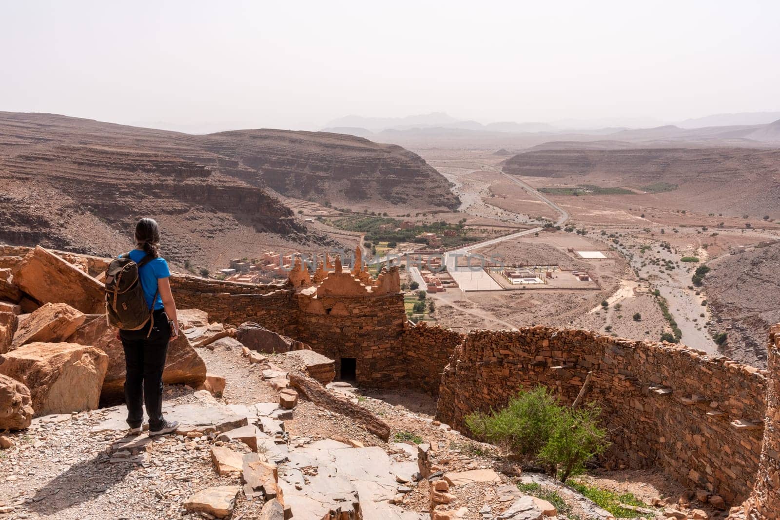 Hiking through the old Id Aissa agadir, an old granary in Amtoudi, Morocco