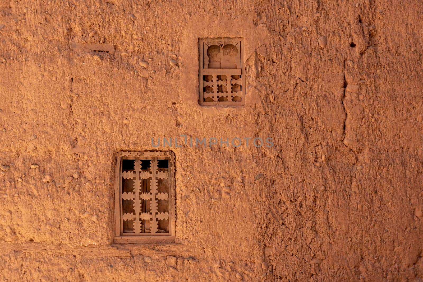 Two little windows in a typical berber house built of clay, Draa valley in Morocco