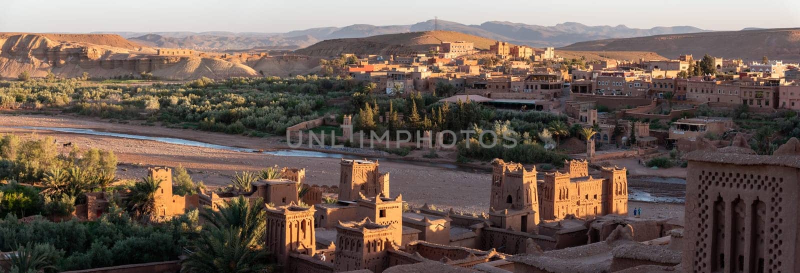 Sunset over the beautiful historic town Ait Ben Haddou in Morocco, famous berber town with many kasbahs built of clay, UNESCO world heritage