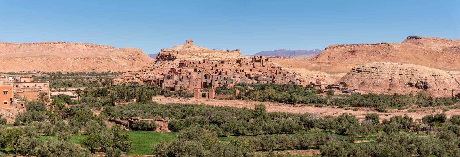 Sunset over the beautiful historic town Ait Ben Haddou in Morocco, famous berber town with many kasbahs built of clay, UNESCO world heritage