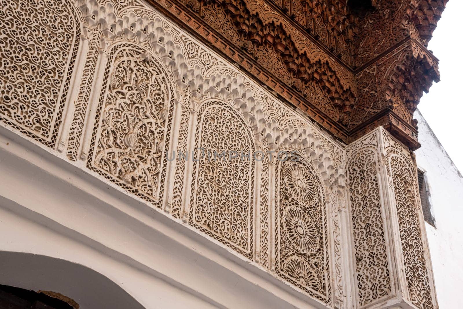 Beautiful ornate relief at a facade of a madrasa in Fes, a Koran school, Morocco