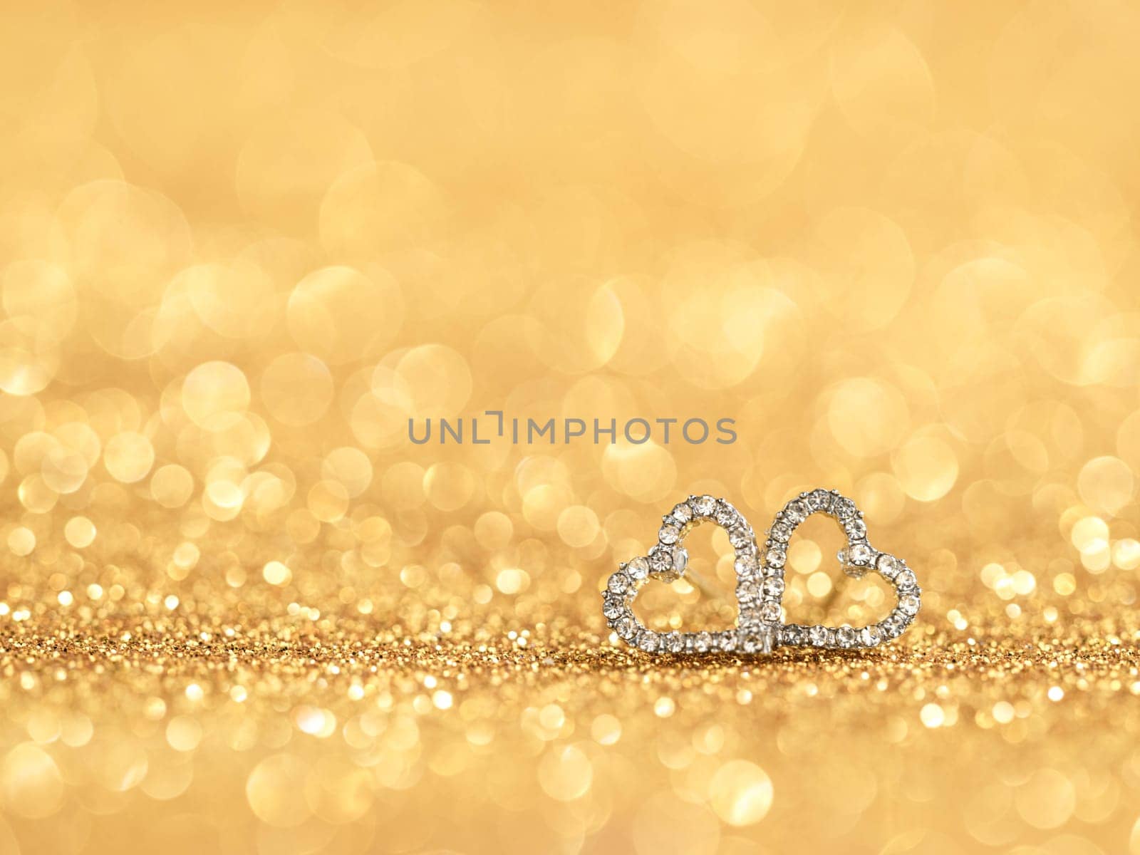 diamond hearts on gold bokeh background love concept