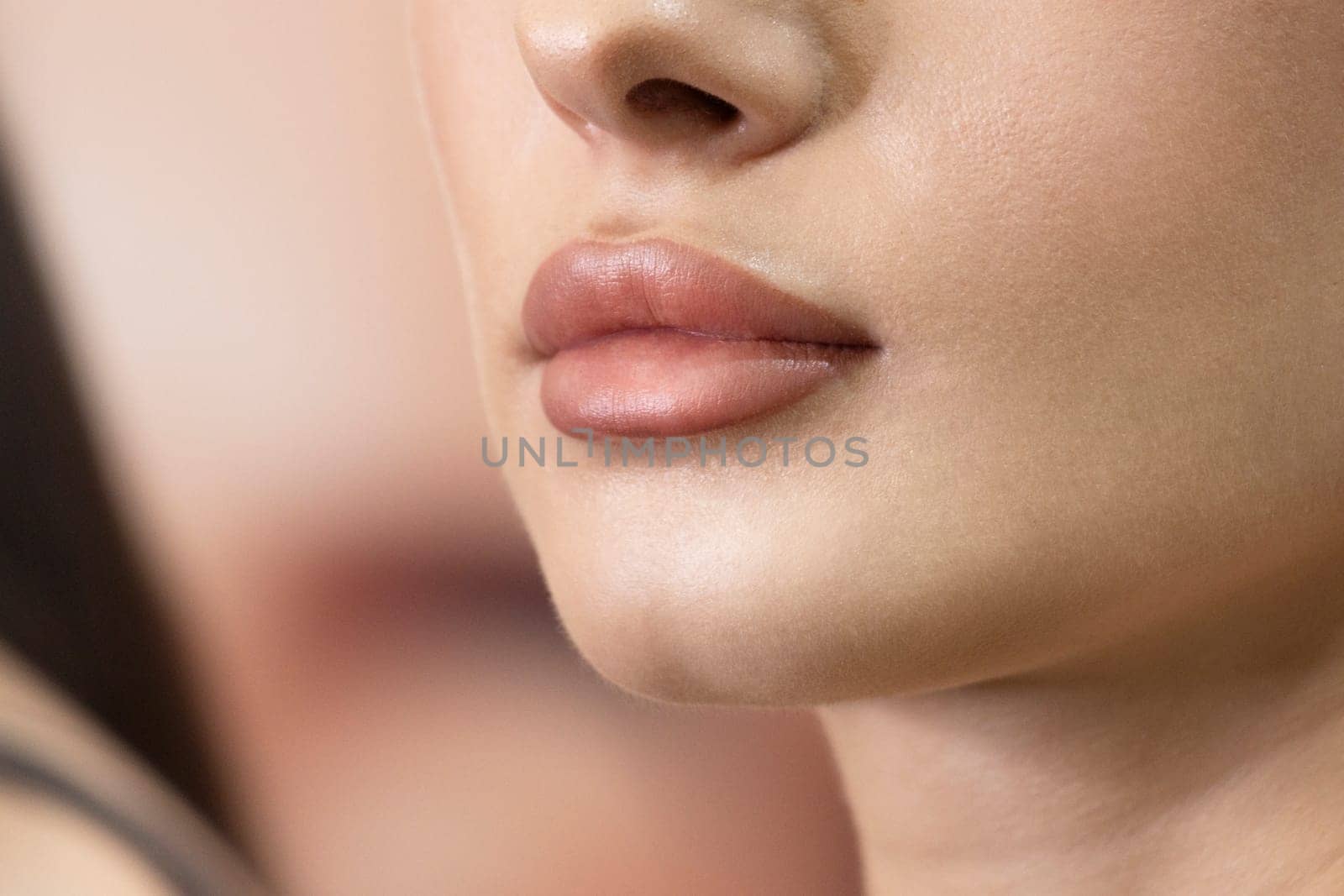 inflated lips of a beautiful girl, change in appearance