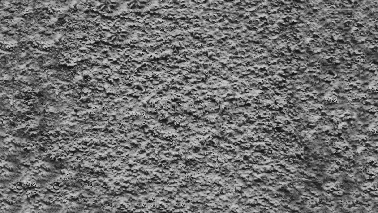 Rough texture of a gray concrete wall.