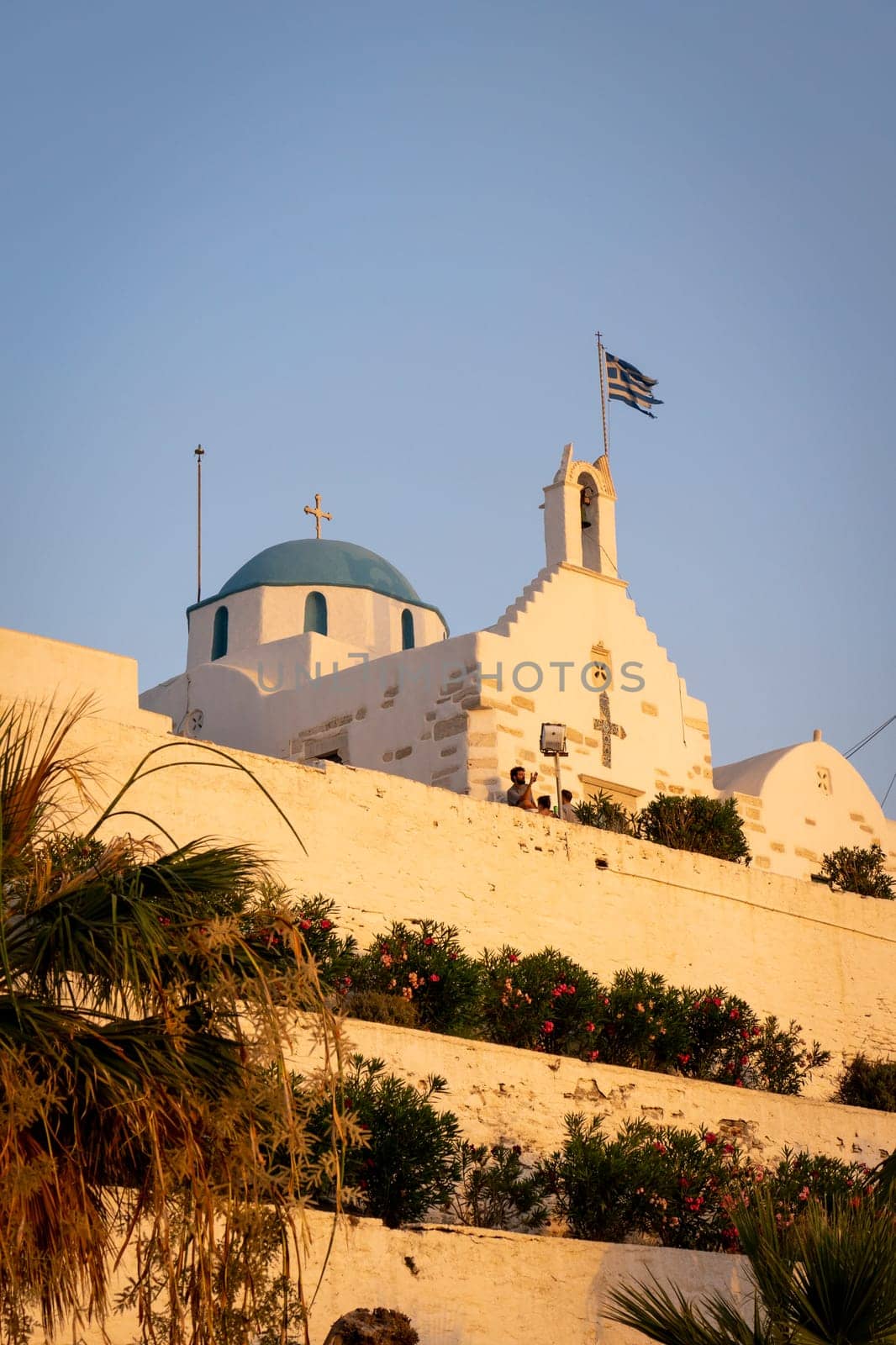 Sunset view of Saint Constantine Panoramic Church from the harbor