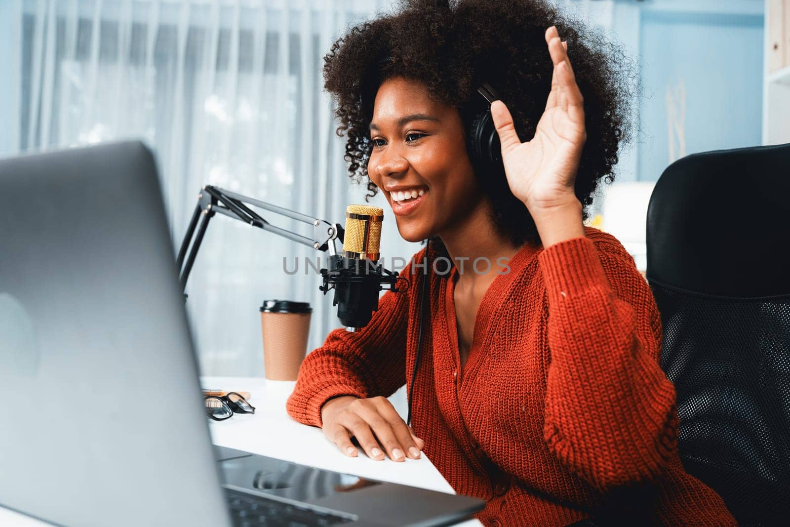 Host channel of beautiful African woman influencer talking with new listeners in broadcast studio. Time slot of life coach consultant on live social media online. Concept of giving advice. Tastemaker.