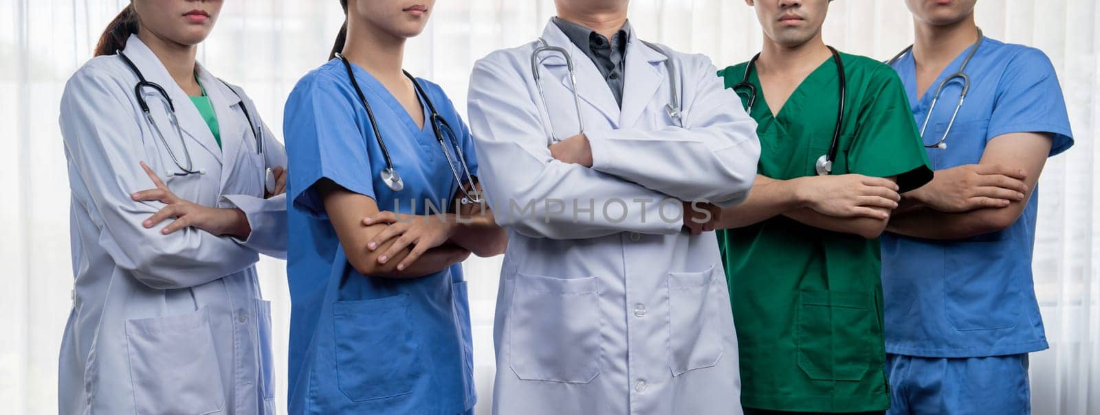 Confident and professional team of medical staff stand in line together. Rigid by biancoblue