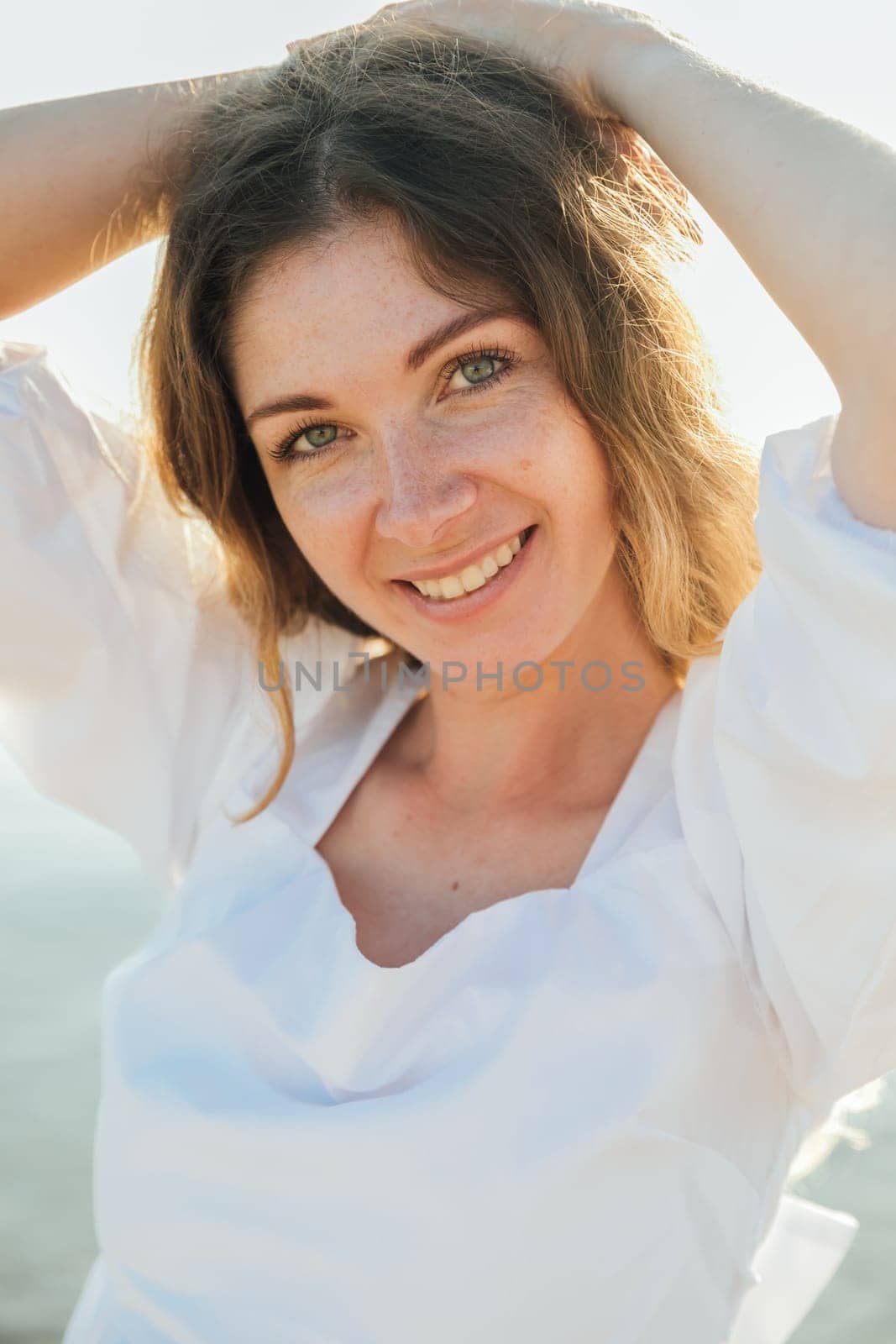 portrait of a beautiful woman on the beach on the street on a walk by Simakov