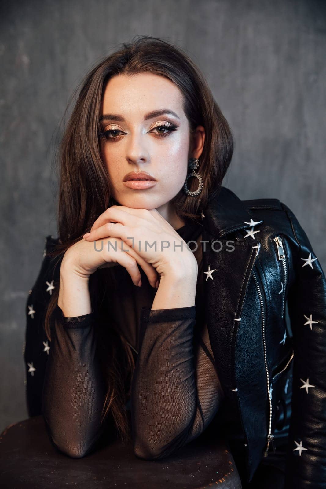 portrait of a beautiful brunette woman on dark background