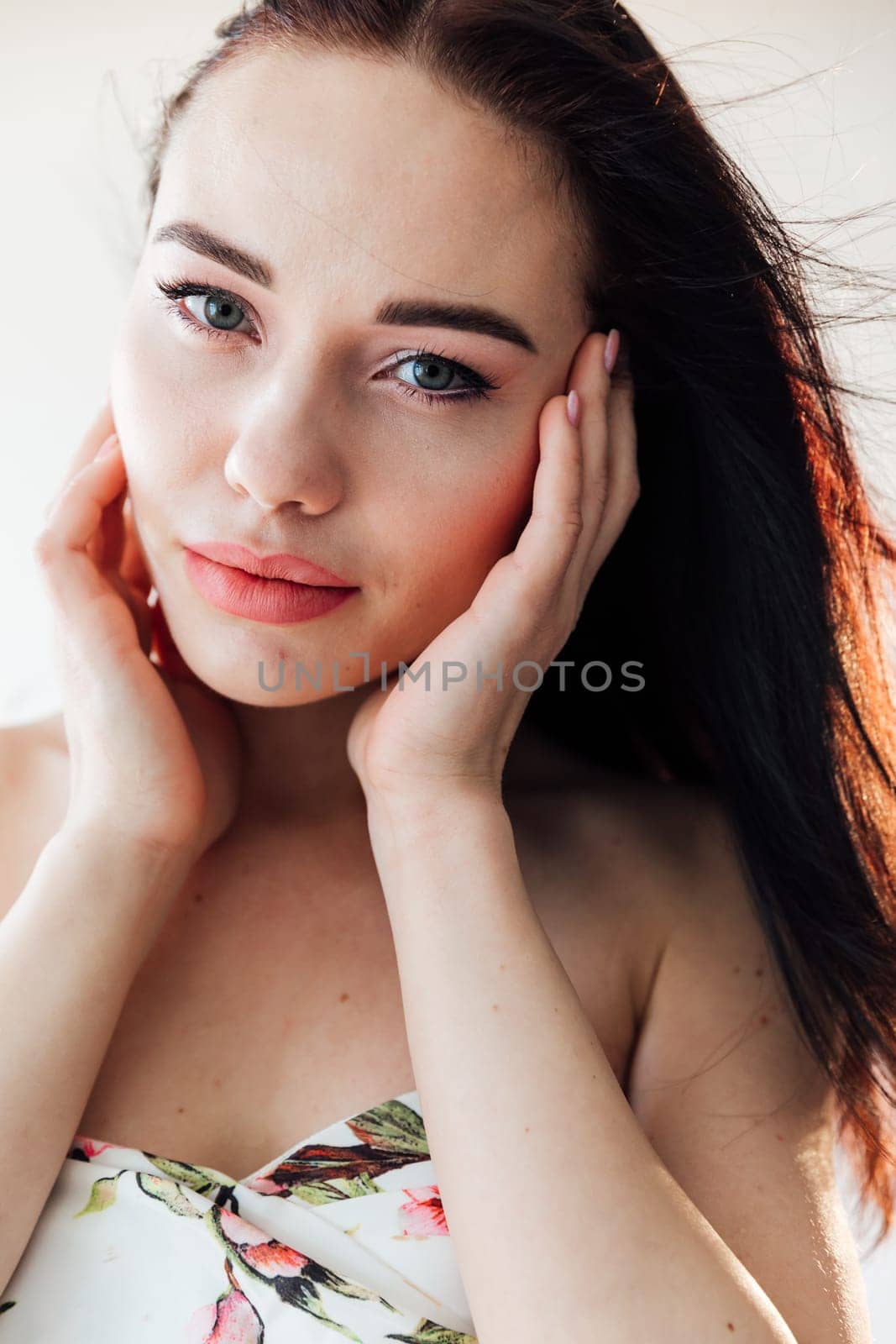 portrait face beautiful brunette woman in summer dress with flowers by Simakov