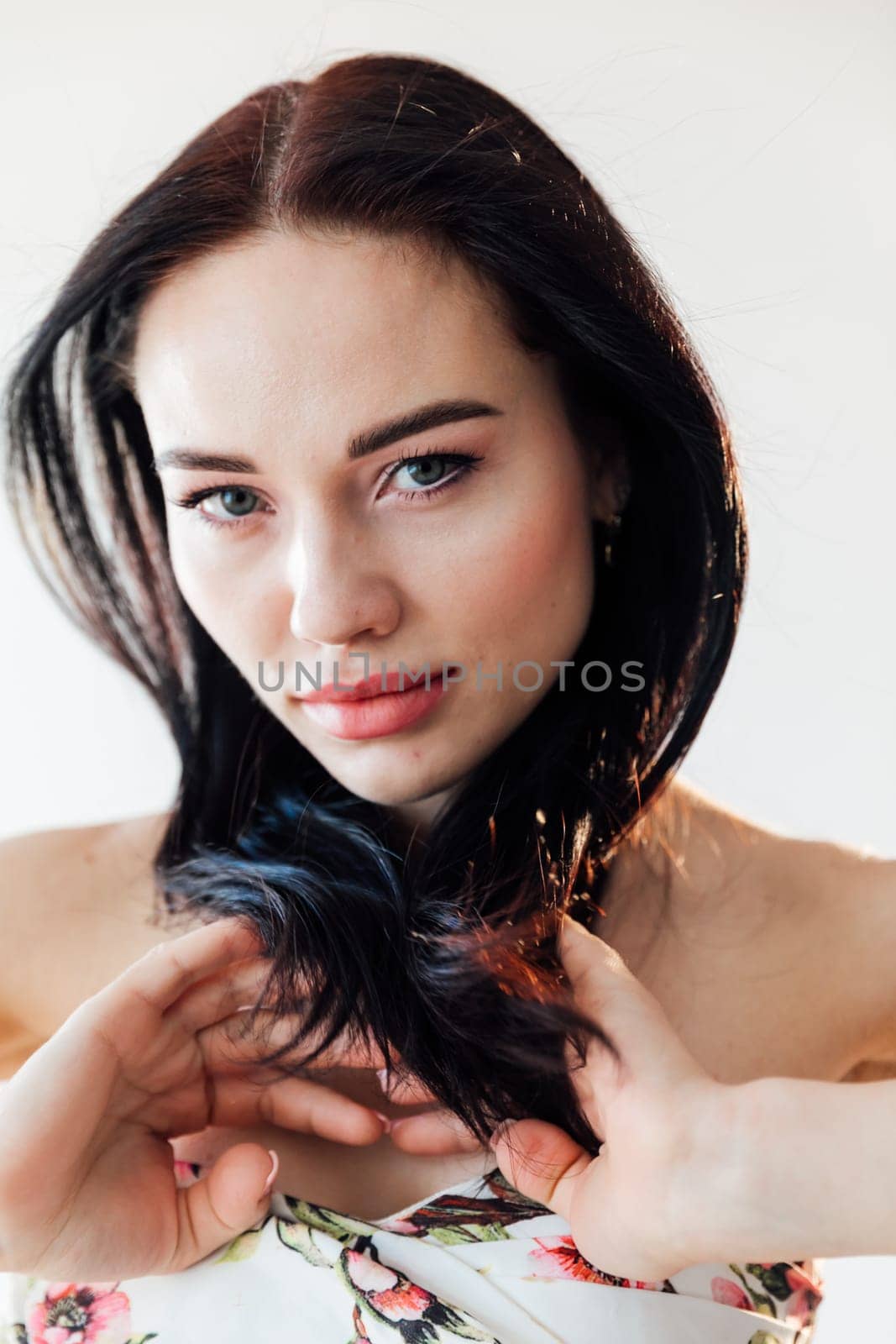 portrait face beautiful brunette woman in summer dress with flowers by Simakov