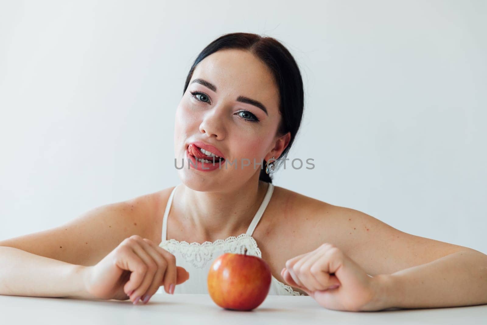 beautiful woman and delicious apple for food by Simakov