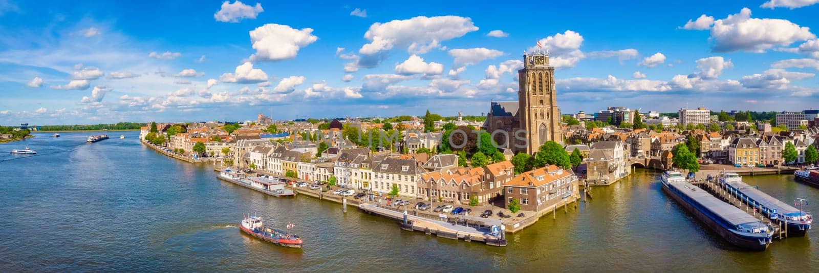 Panoramic view of Dordrecht Netherlands the skyline of the old city of Dordrecht with a church and canal buildings in the Netherlands.