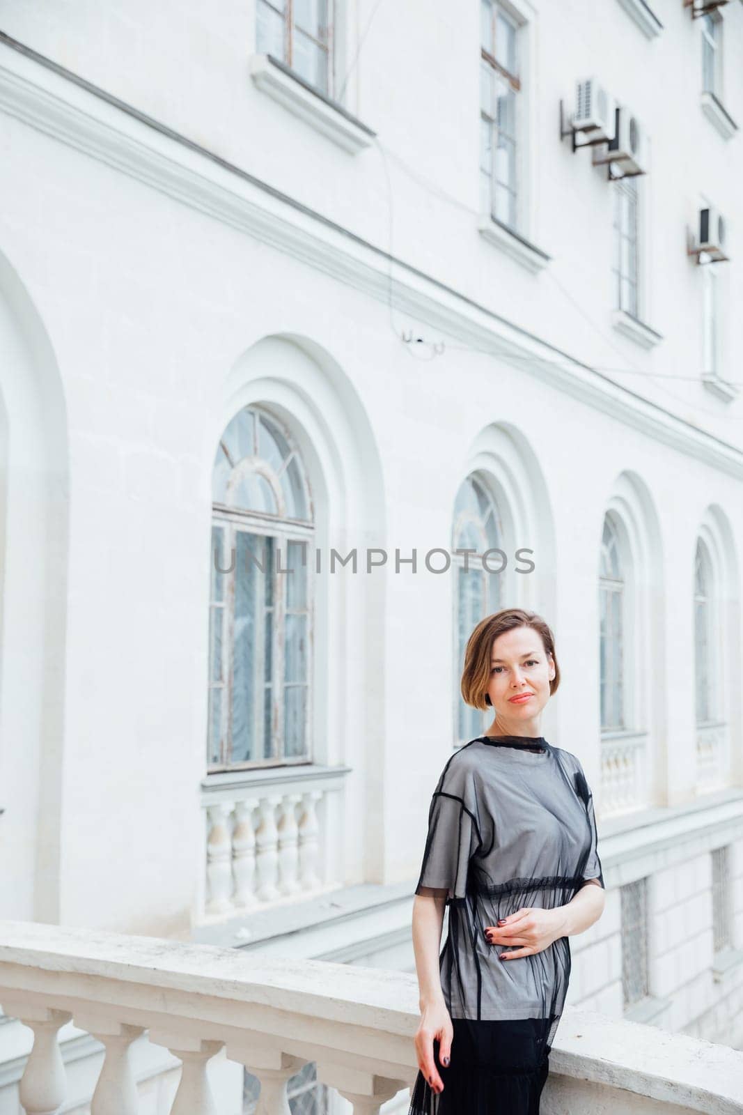 Portrait of beautiful slender fashionable brunette woman by Simakov