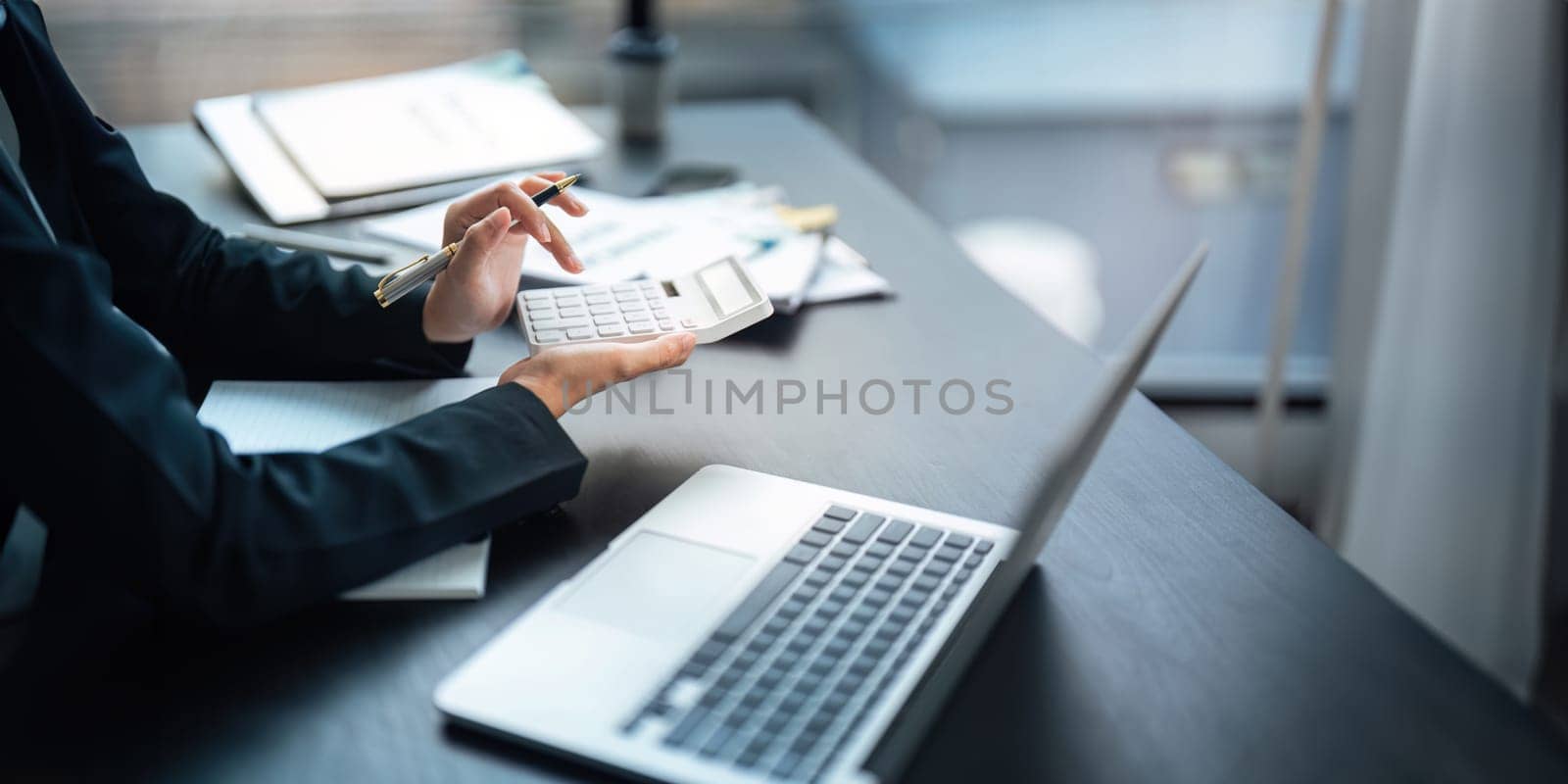 Close up of businessperson analysis and calculate chart and graph showing change and growth on the finance and marketing.