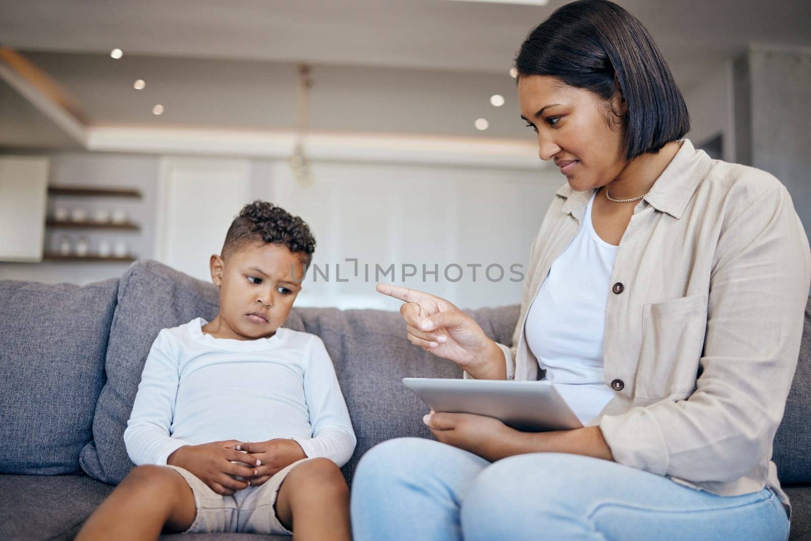Mother, child and scolding or discipline, tablet and punishment at home. Parent and daughter, communication and disappointed for cyberbullying, bad behaviour and frustrated for digital mistake.