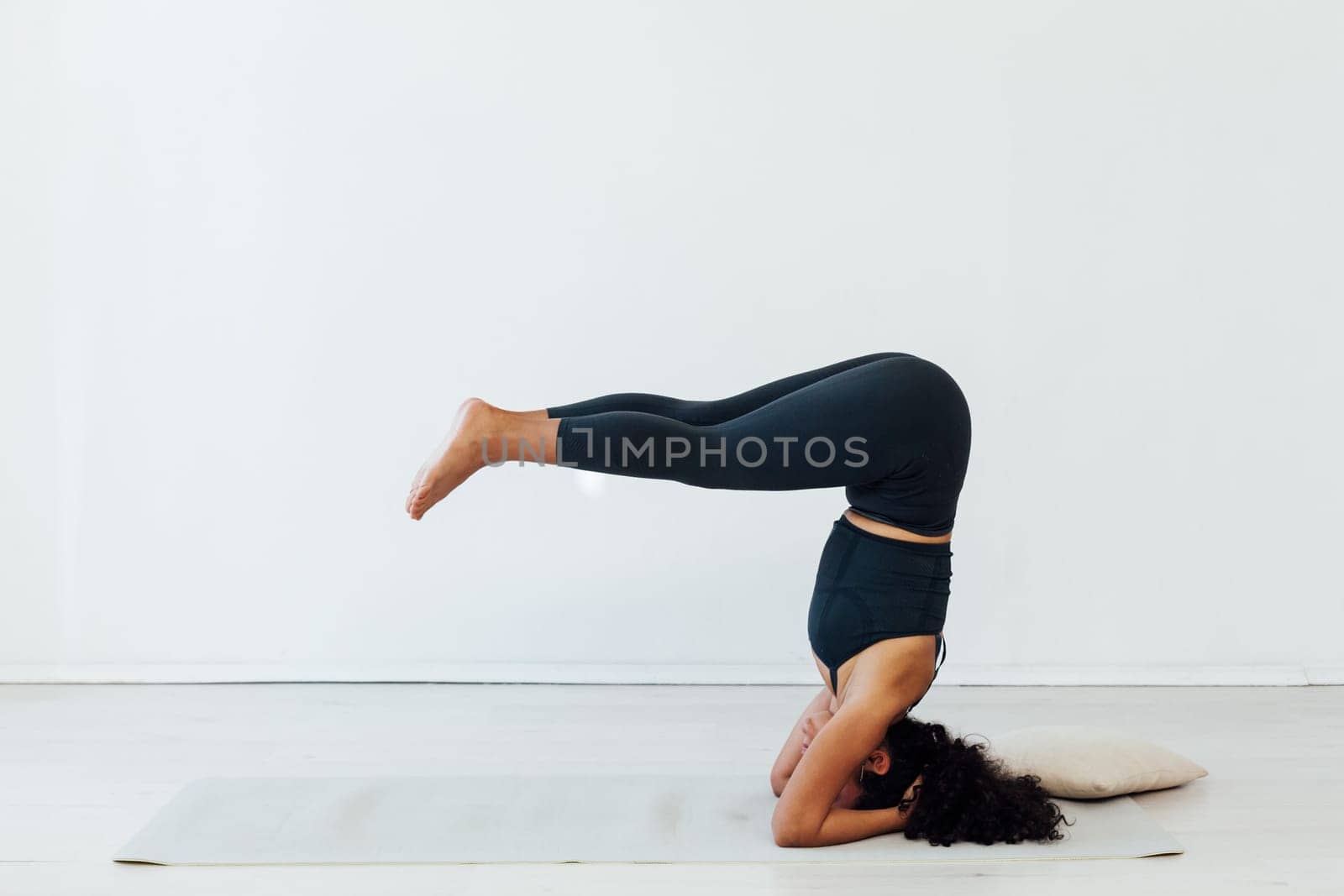 woman doing exercises yoga asana pose workout in the studio
