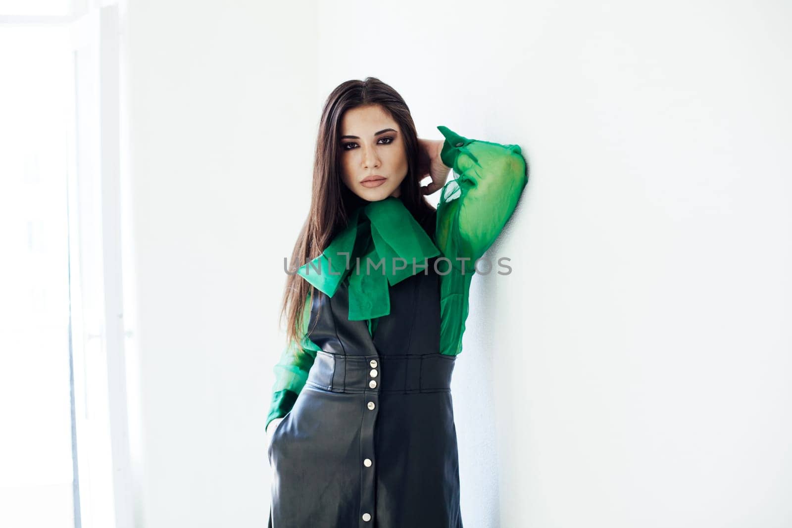 brunette on a white background in a bright room