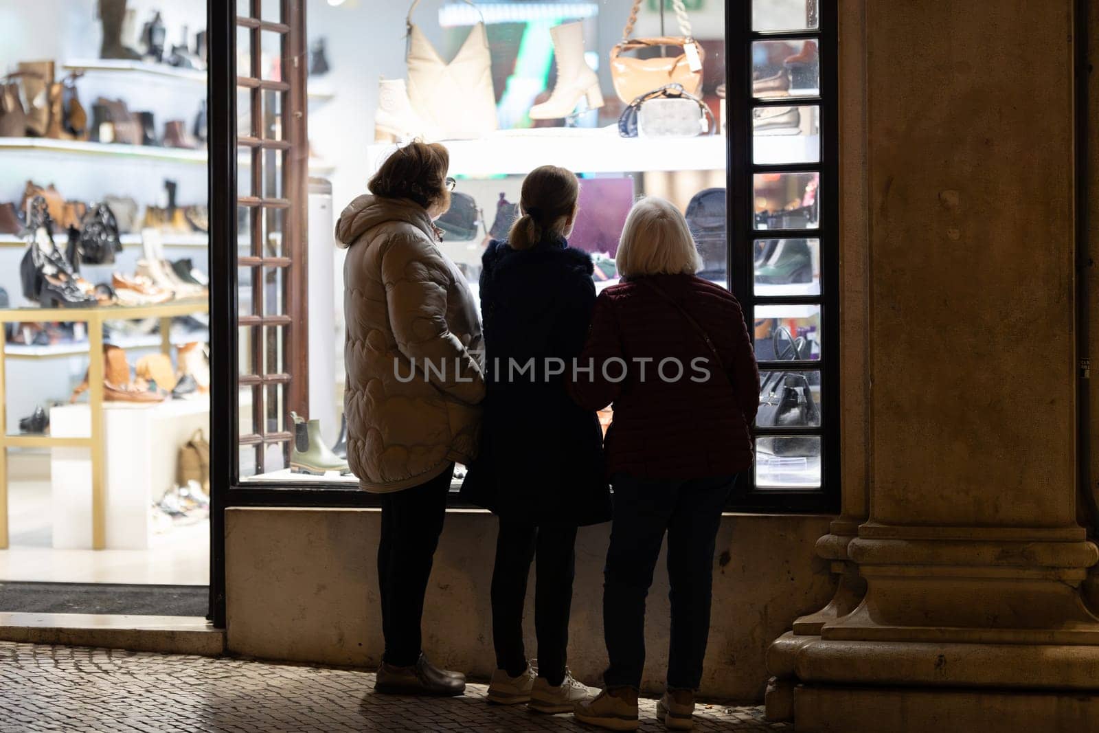 Three Women Admiring the Display at a Fashion Boutique by Studia72