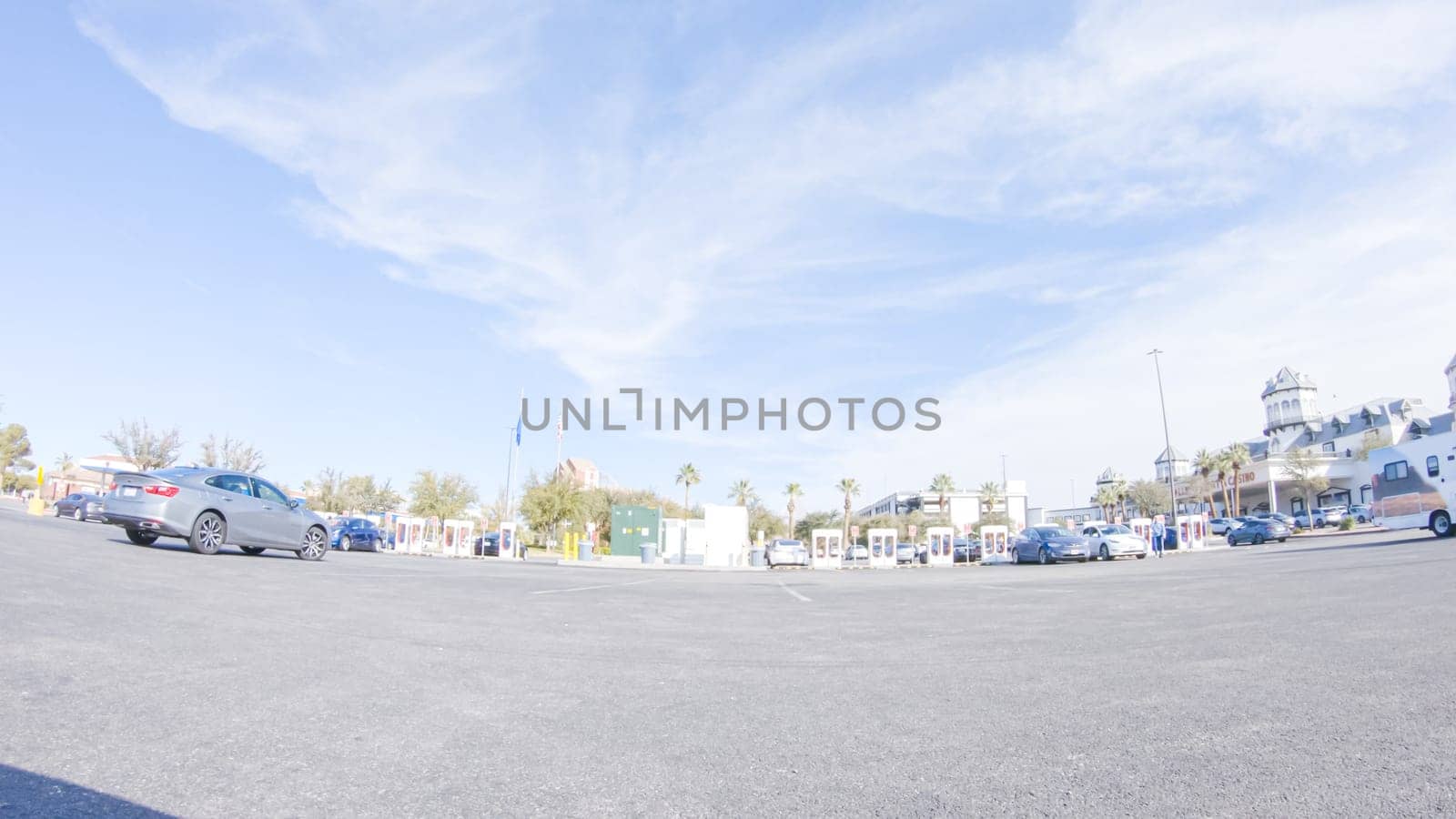 Primm, Nevada, USA-December 3, 2022-During the day, a Tesla vehicle is seen charging at a Tesla Supercharging station, utilizing the high-speed charging infrastructure for convenient and efficient electric vehicle refueling.