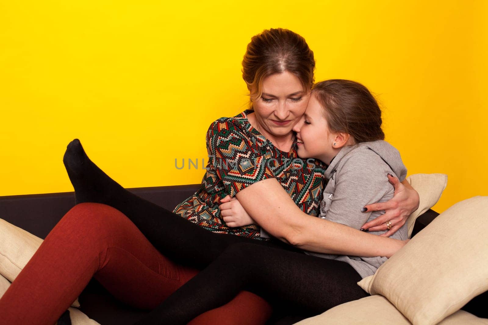 Mom and daughter hugging family together