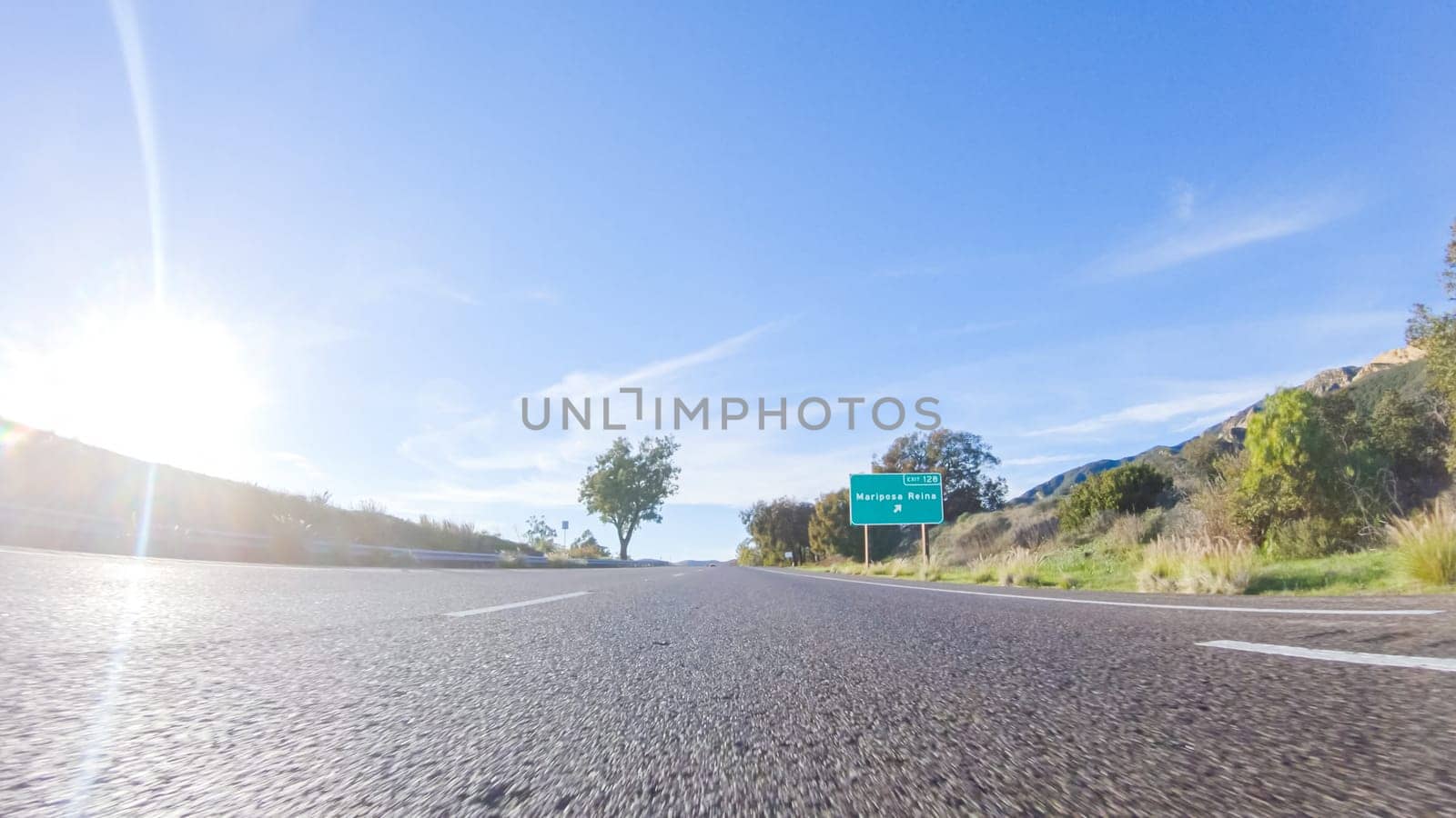 During the day, driving on HWY 101 near Arroyo Quemada Beach, California, offers scenic views of the surrounding coastal landscape.