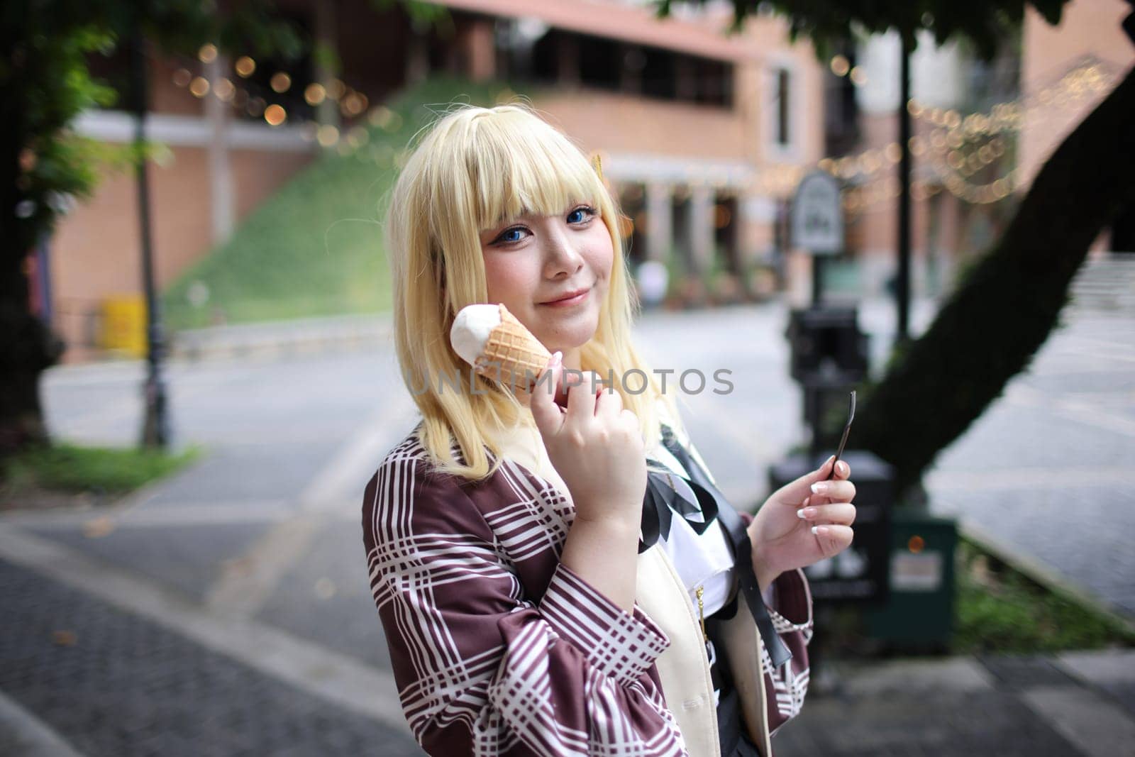 Portrait of a beautiful young woman game Cosplay with blonde hair with ice cream by piyato
